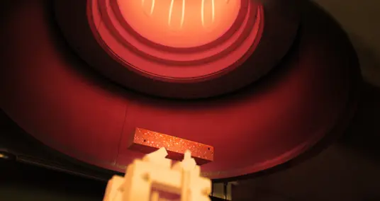 RFDA specimen glowing inside an IMCE high-temperature furnace