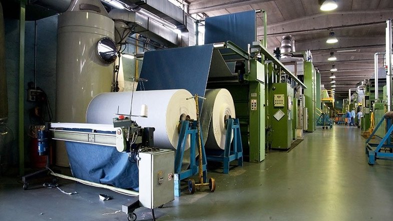 Length measurement of coiled sheet material